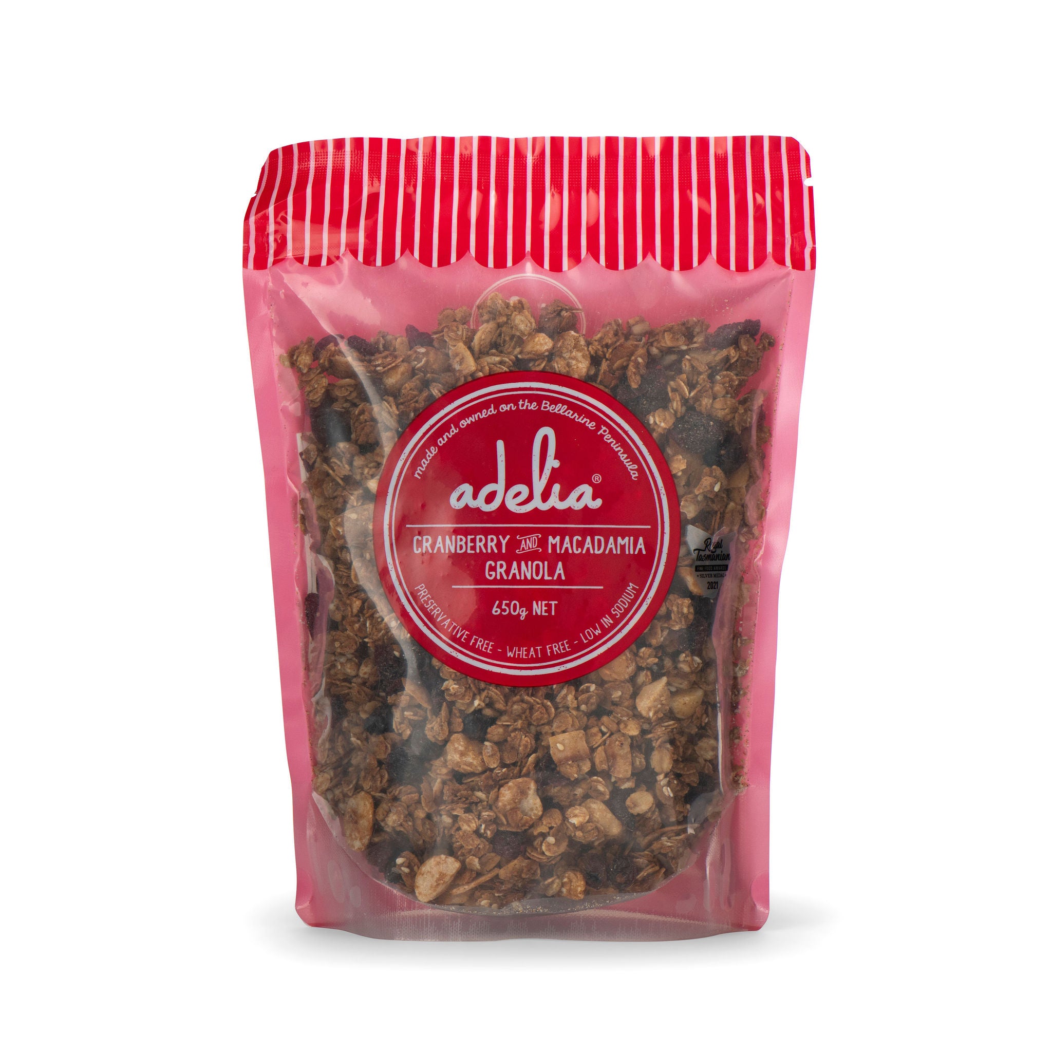 Packaged Cranberry & Macadamia Granola in a clear plastic bag with red  branding