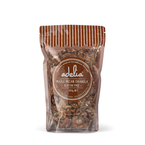 Packaged Maple Pecan Granola in a clear bag with a brown label, indicating it is gluten-free and vegan.